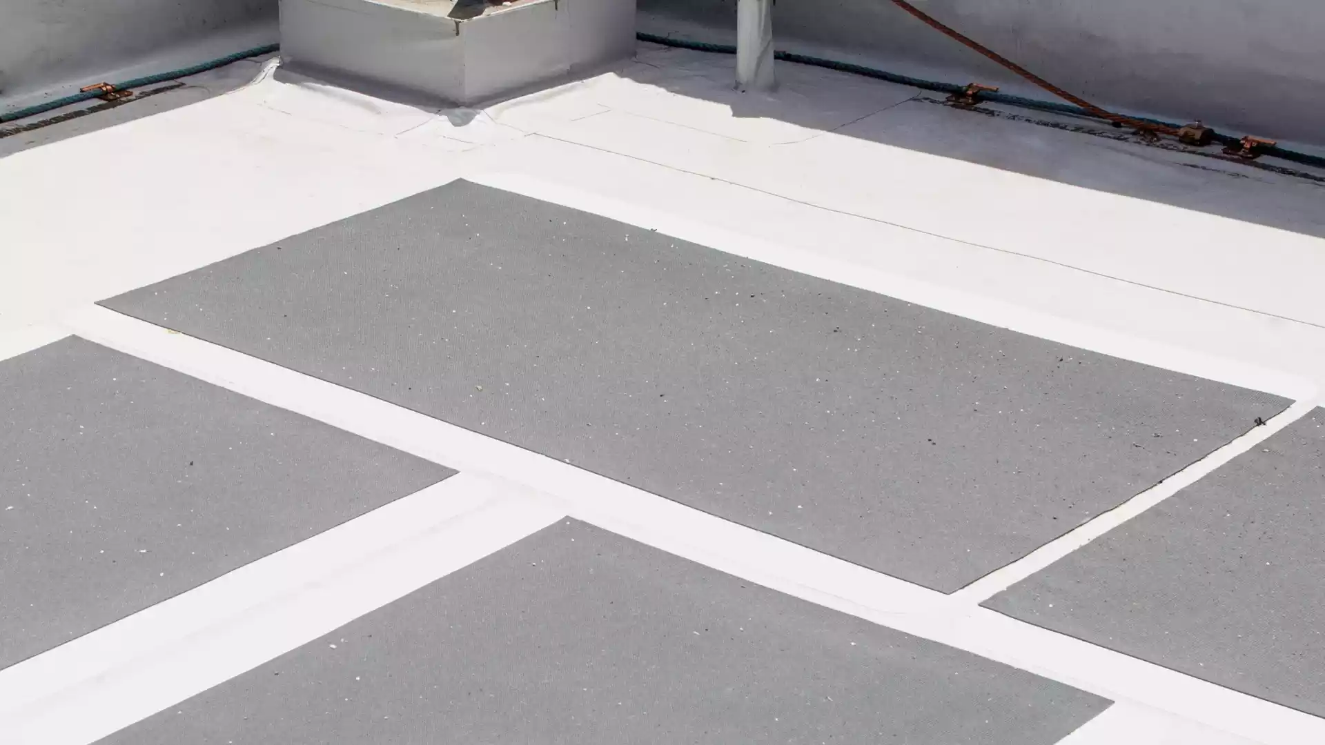 grey walkway pads for non-skid walking surface on white pvc roof